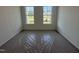 Bedroom featuring lots of natural light with two windows at 2874 Quarry Rd # 165, Rolesville, NC 27571