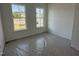 Bedroom featuring lots of natural light with two windows at 2874 Quarry Rd # 165, Rolesville, NC 27571
