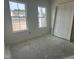 Bright bedroom features two large windows and a closet at 2874 Quarry Rd # 165, Rolesville, NC 27571