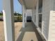 New home boasts a welcoming covered porch with views of the neighborhood at 2874 Quarry Rd # 165, Rolesville, NC 27571