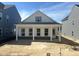 Charming new construction home with inviting front porch and classic white columns at 2874 Quarry Rd # 165, Rolesville, NC 27571