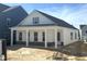 Inviting new construction home with covered porch and classic design elements at 2874 Quarry Rd # 165, Rolesville, NC 27571