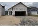 New home construction shows the framing and garage opening prior to final finishing at 2874 Quarry Rd # 165, Rolesville, NC 27571