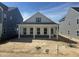 An inviting white home with symmetrical design, complemented by a well-lit, bright blue sky at 2874 Quarry Rd # 165, Rolesville, NC 27571