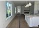 Bright interior view showcasing an open layout, modern kitchen, and natural light from large windows at 2874 Quarry Rd # 165, Rolesville, NC 27571