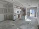 Unfinished kitchen with installed white cabinetry and a center island, new construction at 2874 Quarry Rd # 165, Rolesville, NC 27571