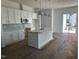 Bright kitchen featuring white cabinets, quartz countertops, stainless steel appliances, and pendant lighting at 2874 Quarry Rd # 165, Rolesville, NC 27571