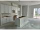 Bright kitchen with white cabinets and center island at 2874 Quarry Rd # 165, Rolesville, NC 27571