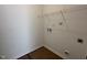Utility room with washer/dryer hookups and wire shelving for storage at 2874 Quarry Rd # 165, Rolesville, NC 27571