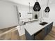 Bright kitchen and dining area with island seating, modern lighting, and large windows at 2911 Alyssa Ct, Raleigh, NC 27604