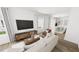 Cozy living room with modern furniture, large windows, and an open layout at 2911 Alyssa Ct, Raleigh, NC 27604