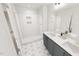 Contemporary bathroom with a glass-enclosed shower, double vanity, and stylish tile flooring at 2915 Alyssa Ct, Raleigh, NC 27604