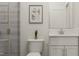 Modern bathroom featuring a sleek vanity, tiled shower, and contemporary fixtures at 312 Calvander Ln, Apex, NC 27539