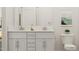 Elegant bathroom with double vanity, neutral paint and contemporary fixtures at 312 Calvander Ln, Apex, NC 27539