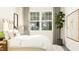 Inviting bedroom with large window, neutral color scheme, and stylish accents at 312 Calvander Ln, Apex, NC 27539