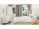 Bright bedroom featuring neutral colors, a comfortable bed, and stylish decor at 312 Calvander Ln, Apex, NC 27539