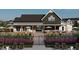 Clubhouse with outdoor seating, manicured landscaping, and a welcoming entrance for community gatherings at 312 Calvander Ln, Apex, NC 27539