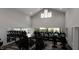 Well-equipped gym with modern treadmills and weight machines, offering a convenient fitness option for residents at 312 Calvander Ln, Apex, NC 27539