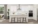 Modern kitchen with an island, sleek countertops, and stainless steel appliances at 312 Calvander Ln, Apex, NC 27539