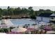 Inviting community pool surrounded by lush landscaping, lounge chairs, and a recreational building at 312 Calvander Ln, Apex, NC 27539
