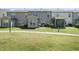 Townhome backyard with lawn, patio, and low shrubbery offer a relaxing outdoor retreat at 322 Brier Crossings Loop, Durham, NC 27703