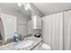 Bathroom featuring a granite countertop vanity and a shower with a patterned curtain at 322 Brier Crossings Loop, Durham, NC 27703