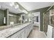 Bathroom features a double vanity with granite countertops and a view into the bedroom at 322 Brier Crossings Loop, Durham, NC 27703