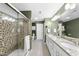 Bathroom featuring a tiled shower and a double vanity with granite countertops at 322 Brier Crossings Loop, Durham, NC 27703