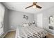 Bedroom featuring a ceiling fan, neutral paint, and a window at 322 Brier Crossings Loop, Durham, NC 27703