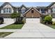 Well-manicured lawn and a two-car garage enhance this two-story townhome with beautiful curb appeal at 322 Brier Crossings Loop, Durham, NC 27703