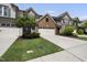 Attractive townhome boasts a two-car garage and lush front yard landscaping at 322 Brier Crossings Loop, Durham, NC 27703