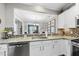 Stylish kitchen with stainless steel appliances, granite counters, and views into the adjacent living space at 322 Brier Crossings Loop, Durham, NC 27703