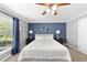 Comfortable bedroom featuring a bed, nightstands, ceiling fan and natural light at 322 Brier Crossings Loop, Durham, NC 27703