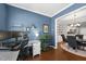 Bright office with a desk and shelving, adjacent to the dining room and kitchen at 322 Brier Crossings Loop, Durham, NC 27703