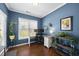 Inviting home office space features a desk, shelves and plenty of natural light at 322 Brier Crossings Loop, Durham, NC 27703