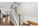 Staircase featuring carpeted steps, white banisters and wooden handrail and trim at 322 Brier Crossings Loop, Durham, NC 27703