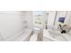 A bathroom featuring a shower-tub combo, a sink, and a toilet at 332 Cottage Hl, Knightdale, NC 27604