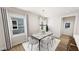 Bright dining room with a stylish chandelier and seating for six at 332 Cottage Hl, Knightdale, NC 27604