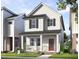Charming two-story home with a welcoming front porch and landscaped yard at 332 Cottage Hl, Knightdale, NC 27604