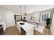 Open concept kitchen and dining area with modern finishes and lots of natural light at 332 Cottage Hl, Knightdale, NC 27604