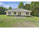 View of the backyard featuring a well-maintained lawn and the back of the home at 3404 Apple Meadow Dr, Fuquay Varina, NC 27526