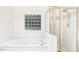 Bathroom with a soaking tub and a separate glass enclosed shower at 3404 Apple Meadow Dr, Fuquay Varina, NC 27526