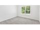Neutral bedroom with light gray carpet and natural light from window at 3404 Apple Meadow Dr, Fuquay Varina, NC 27526