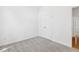 A clean bedroom with light gray carpet, a closet with double doors, and neutral walls at 3404 Apple Meadow Dr, Fuquay Varina, NC 27526