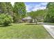 Spacious, well-kept lawn enhances this charming brick home's curb appeal at 3404 Apple Meadow Dr, Fuquay Varina, NC 27526