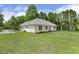 Spacious backyard featuring the rear exterior of the home at 3404 Apple Meadow Dr, Fuquay Varina, NC 27526