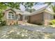 Charming brick home with a curved walkway and well-maintained landscaping at 3404 Apple Meadow Dr, Fuquay Varina, NC 27526
