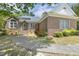 Charming brick home with a curved walkway and well-maintained landscaping at 3404 Apple Meadow Dr, Fuquay Varina, NC 27526