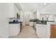 Bright kitchen featuring white cabinets, stainless steel appliances, and tile floor at 3404 Apple Meadow Dr, Fuquay Varina, NC 27526