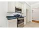 View of the kitchen featuring modern appliances and white cabinetry at 3404 Apple Meadow Dr, Fuquay Varina, NC 27526